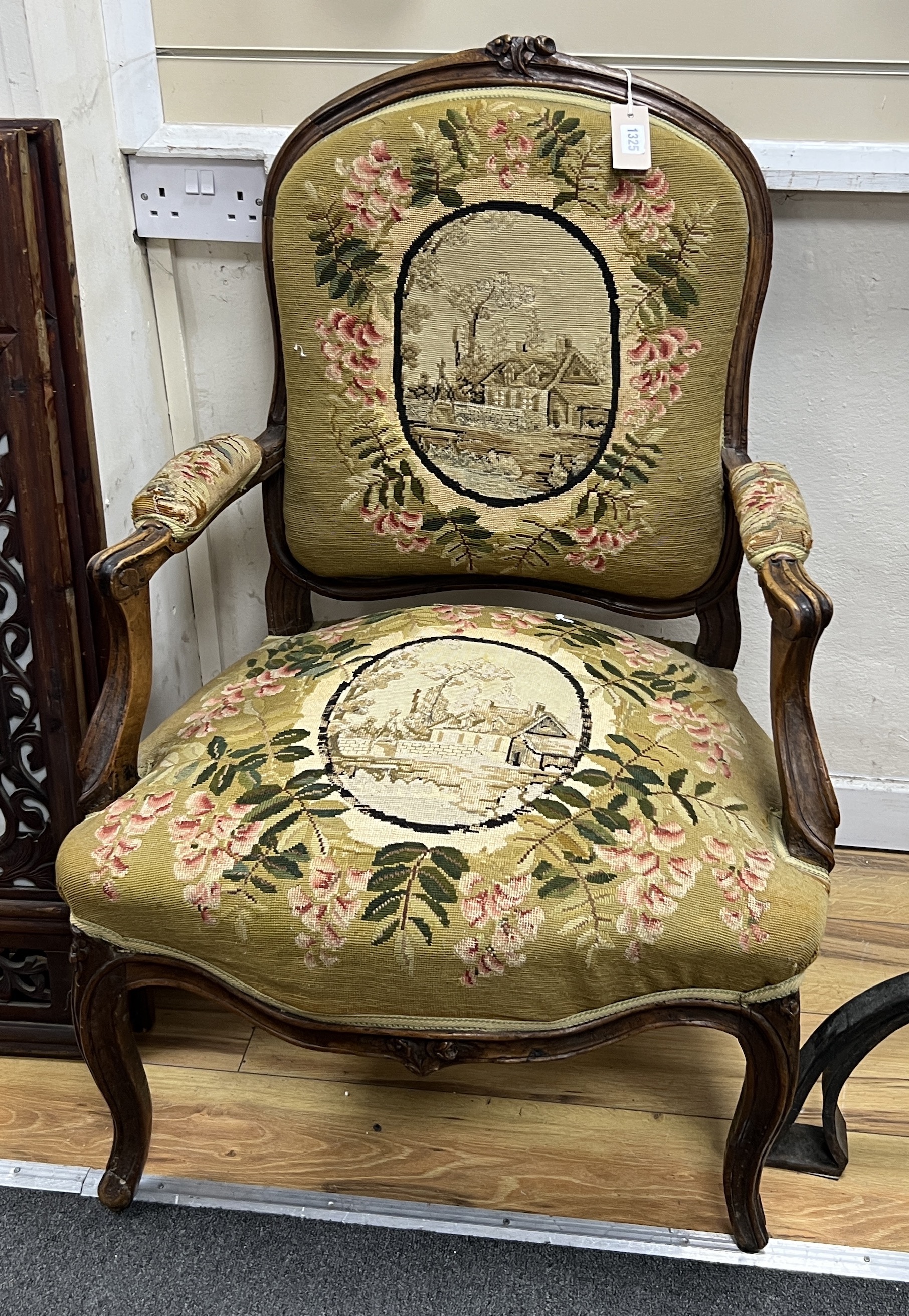 A French carved walnut tapestry fauteuil, width 64cm, depth 64cm, height 96cm